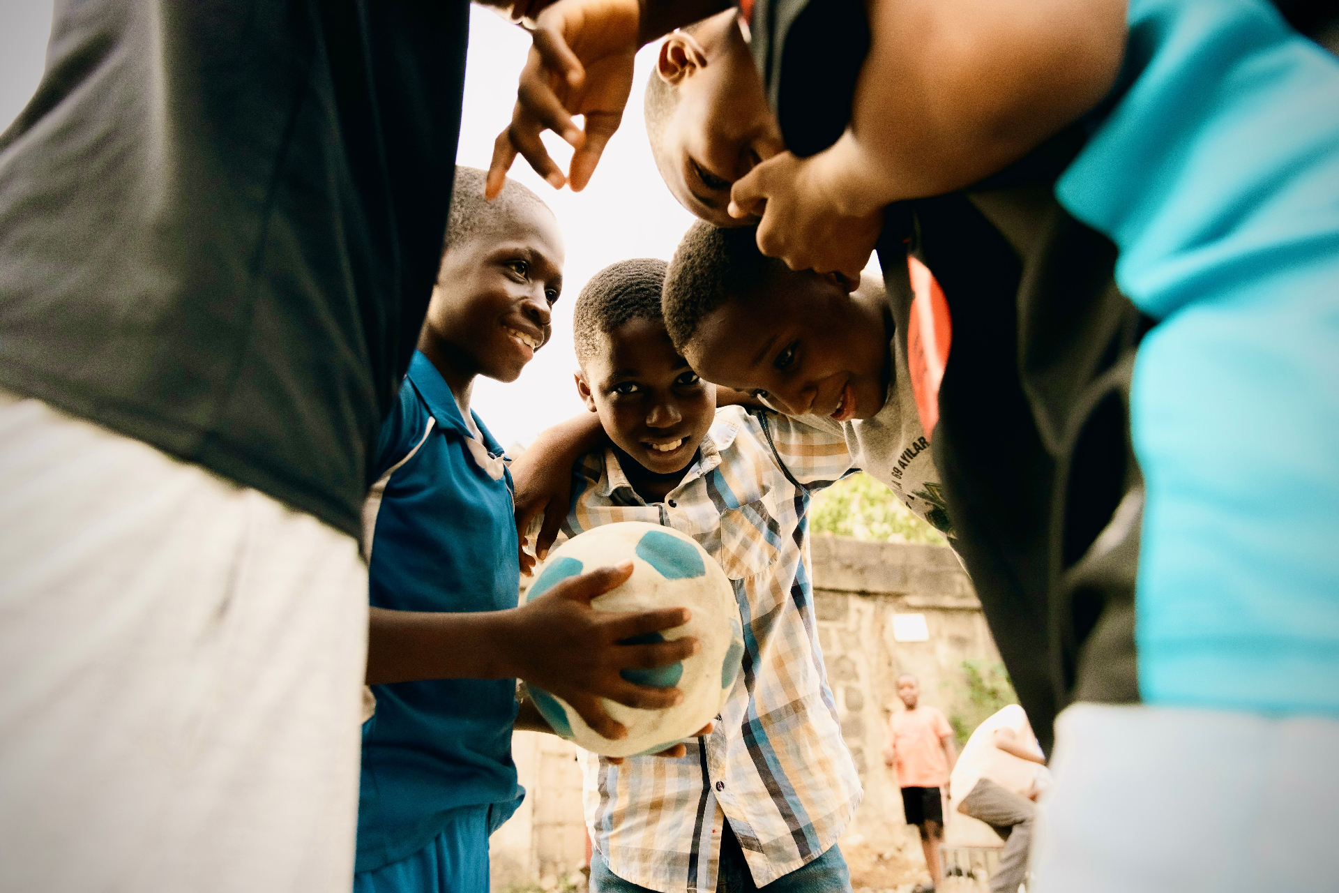 Kids playing sport together outdoors